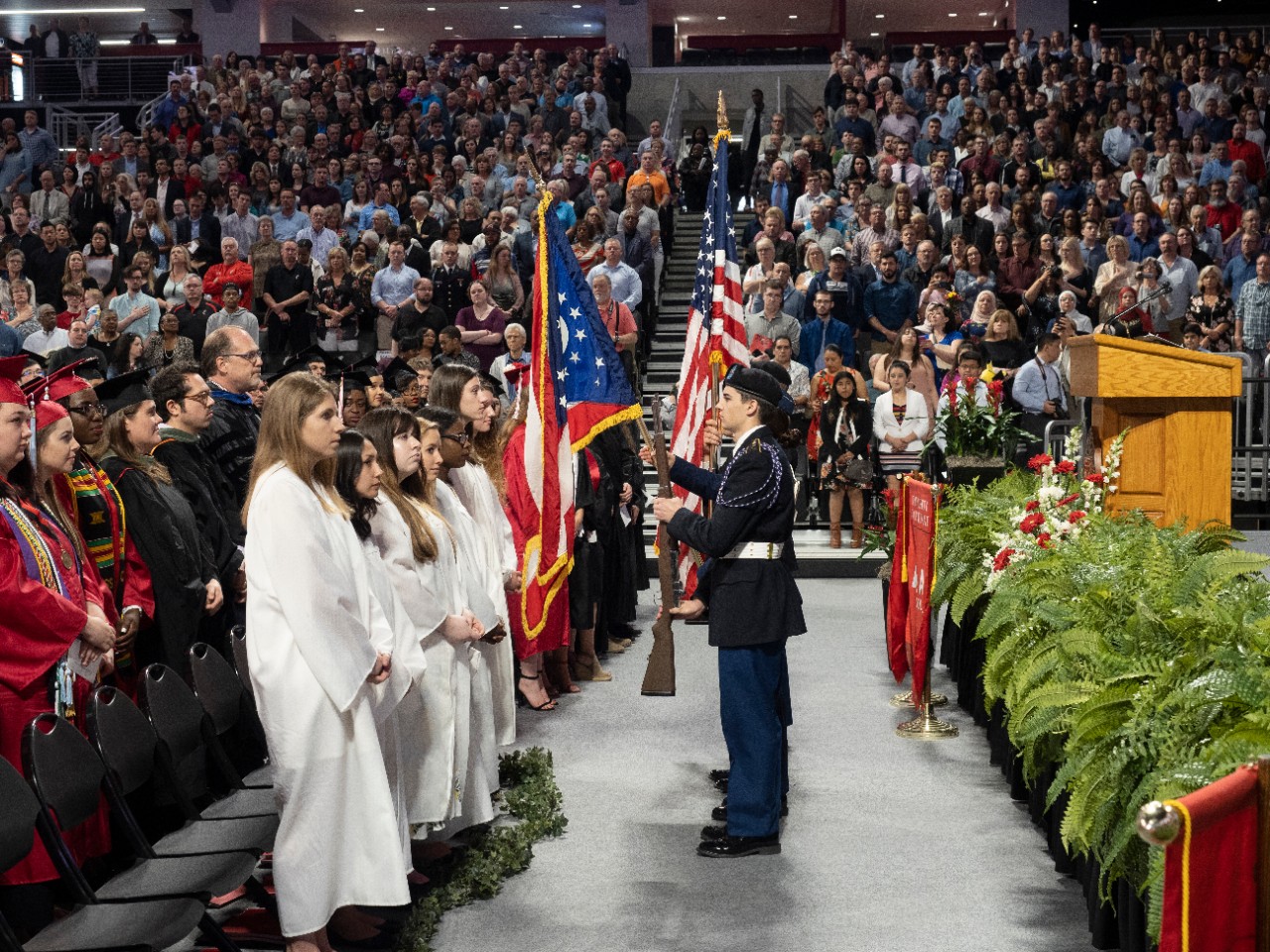The scene on stage during the presentation of the colors at Fifth Third Arena.