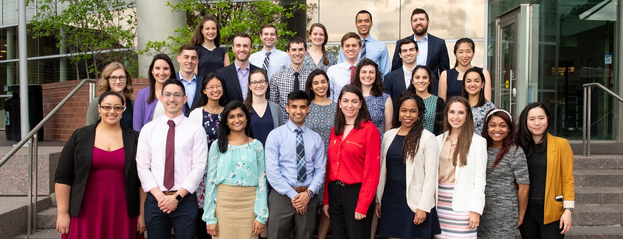 Inductees of the Gold Humanism Award are shown in front of the UC College of Medicine.