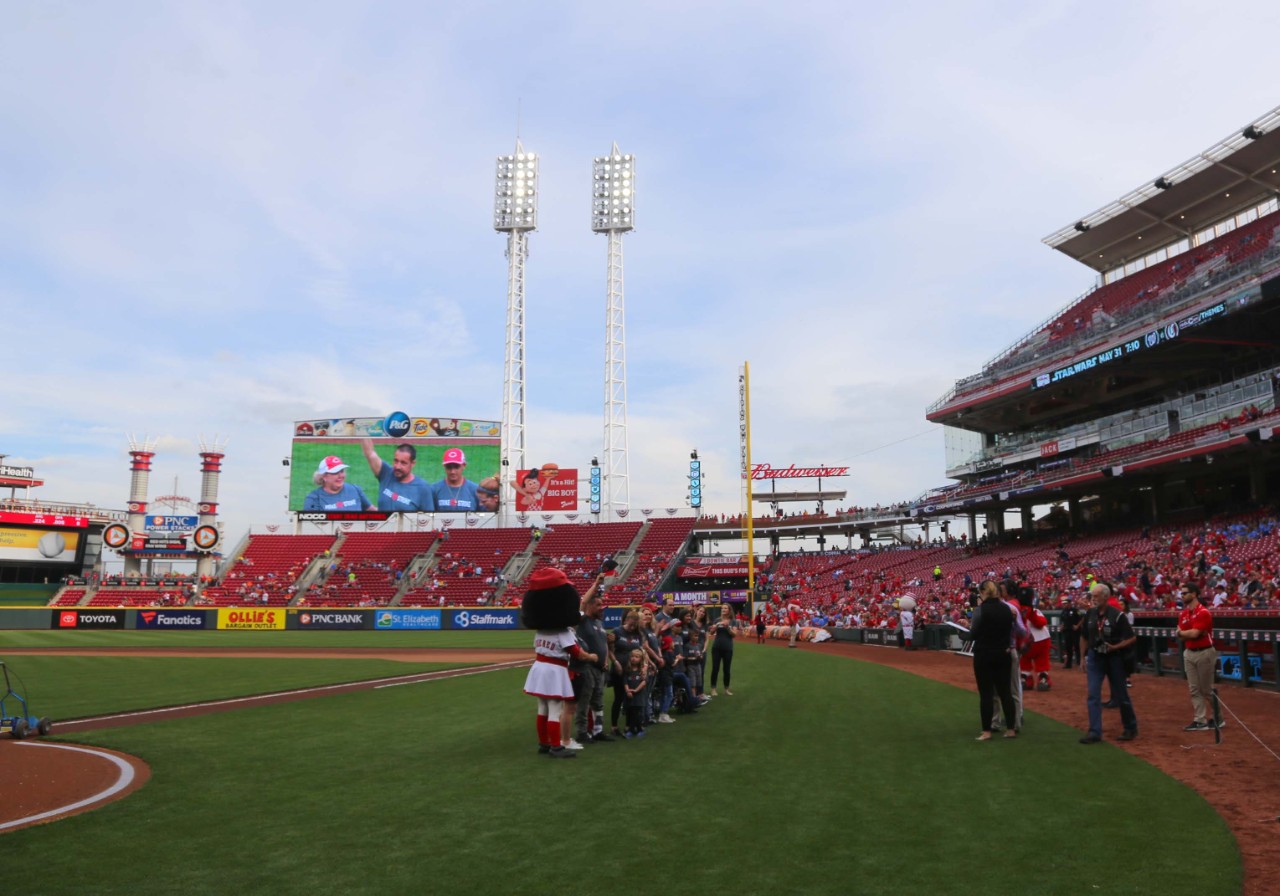 A group of honorary dignitaries lines up for photos at Great American Ball Park.