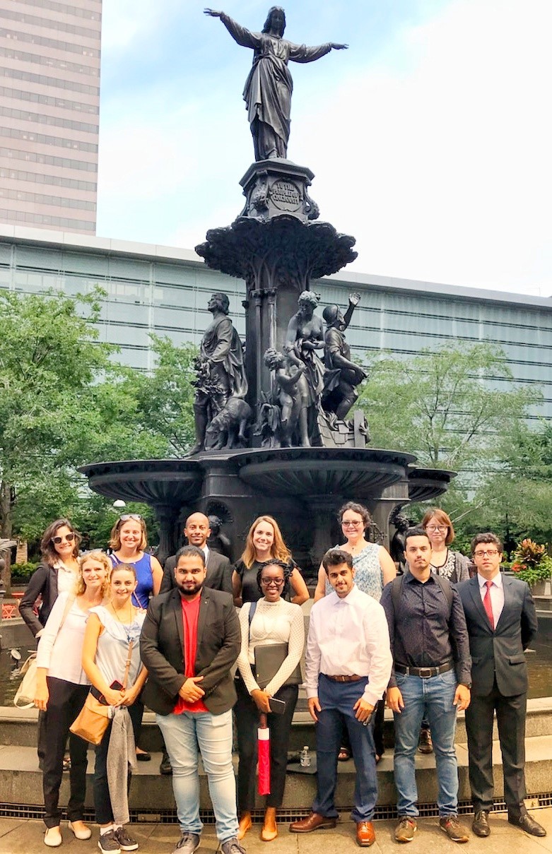 A group of LLM students stand in front of Cincinnati’s Tyler Davidson Fountain.