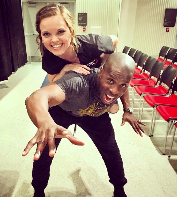 Amanda Bright sits on national comedian Godfrey's shoulders during a night of comedy on UC's campus.