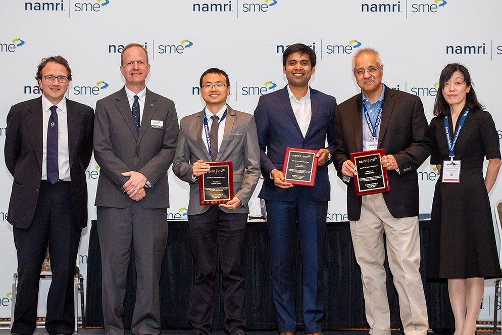 Anand, Zhang and Goel receive the best paper plaques. Left to right: Livan Fratini, Ph.D., NAMRI/SME Scientific Committee Chair, University of Palermo, Palermo, Italy; Albert Wavering, Chief of the Intelligent Systems Division of the Engineering Laboratory at the National Institute of Standards and Technology (NIST); Botao Zhang, Ph.D. student working with Prof. Anand in the area of  Additive Manufacturing; Archak Goel,  recently graduated MS student working at Xerox Palo Alto Research Center in Additive Manufacturing modeling; Sam Anand, Ph.D., Professor,  Director of Siemens Simulation Technology Center; Hitomi Yamaguchi Greenslet, Dr. Eng., NAMRI/SME President, University of Florida, Gainesville, Florida.