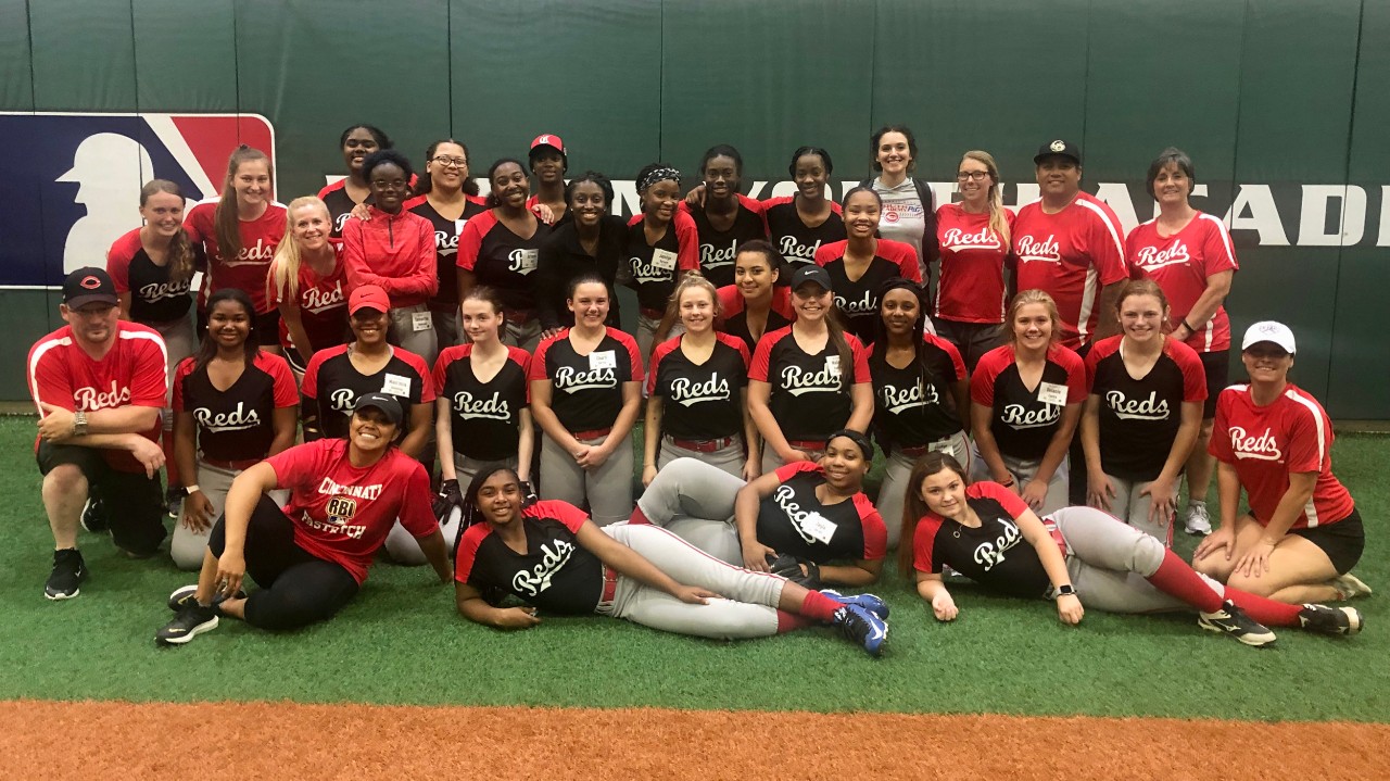 Girls softball players gather together during UC's 2019 Home Base camp.