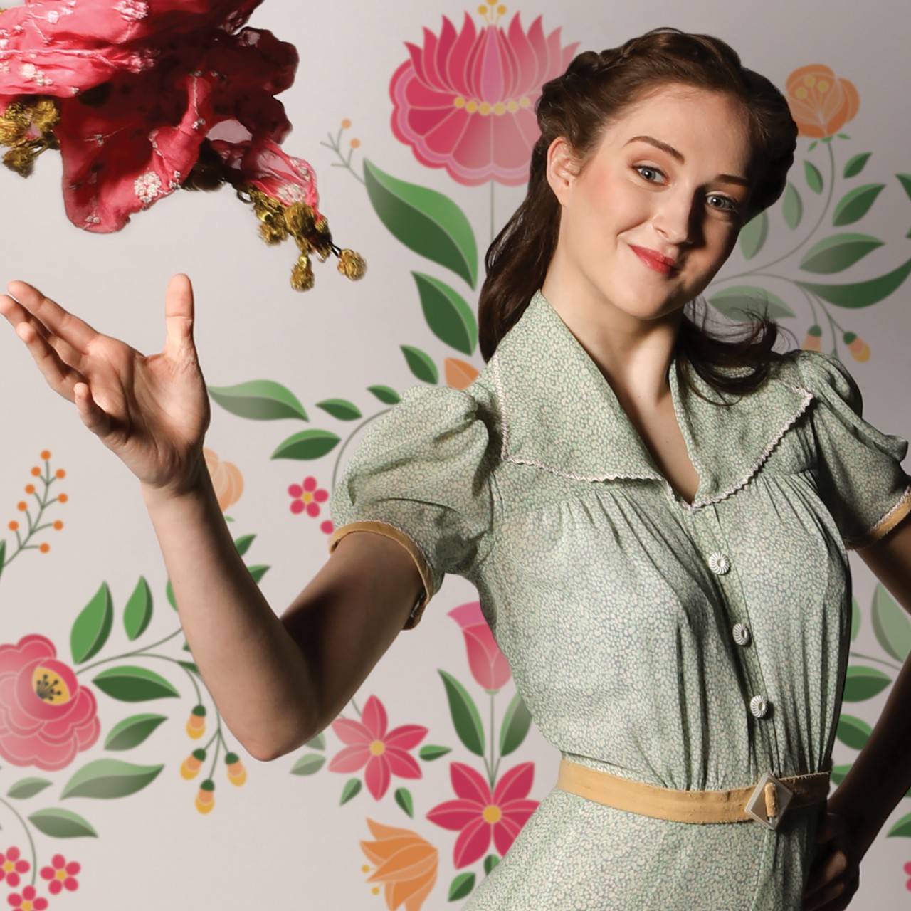 A woman throws a bouquet in a promotional image for the opera 'The Bartered Bride.' Photo by Mark Lyons.