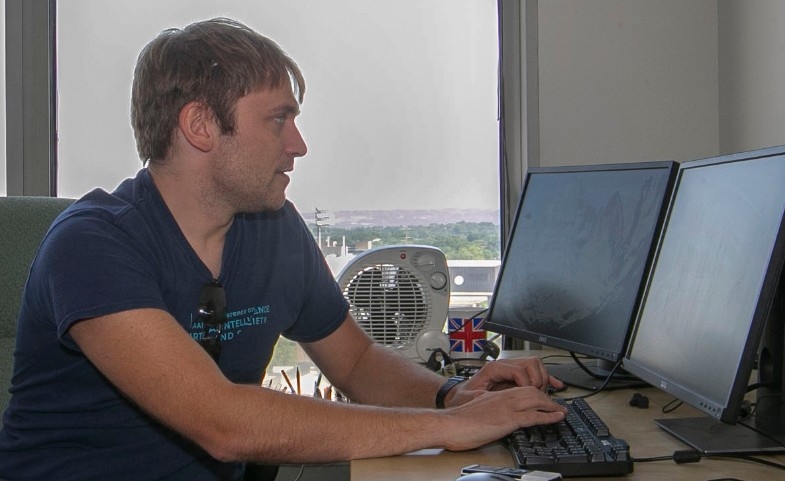 Dieter Vanderelst, UC psychology professor shown in his office at Edwards One building. Vanderelst spoke about his worked on bats use echolocation to overcome the camouflage of their favorite foods, insects.  UC/Joseph Fuqua II 