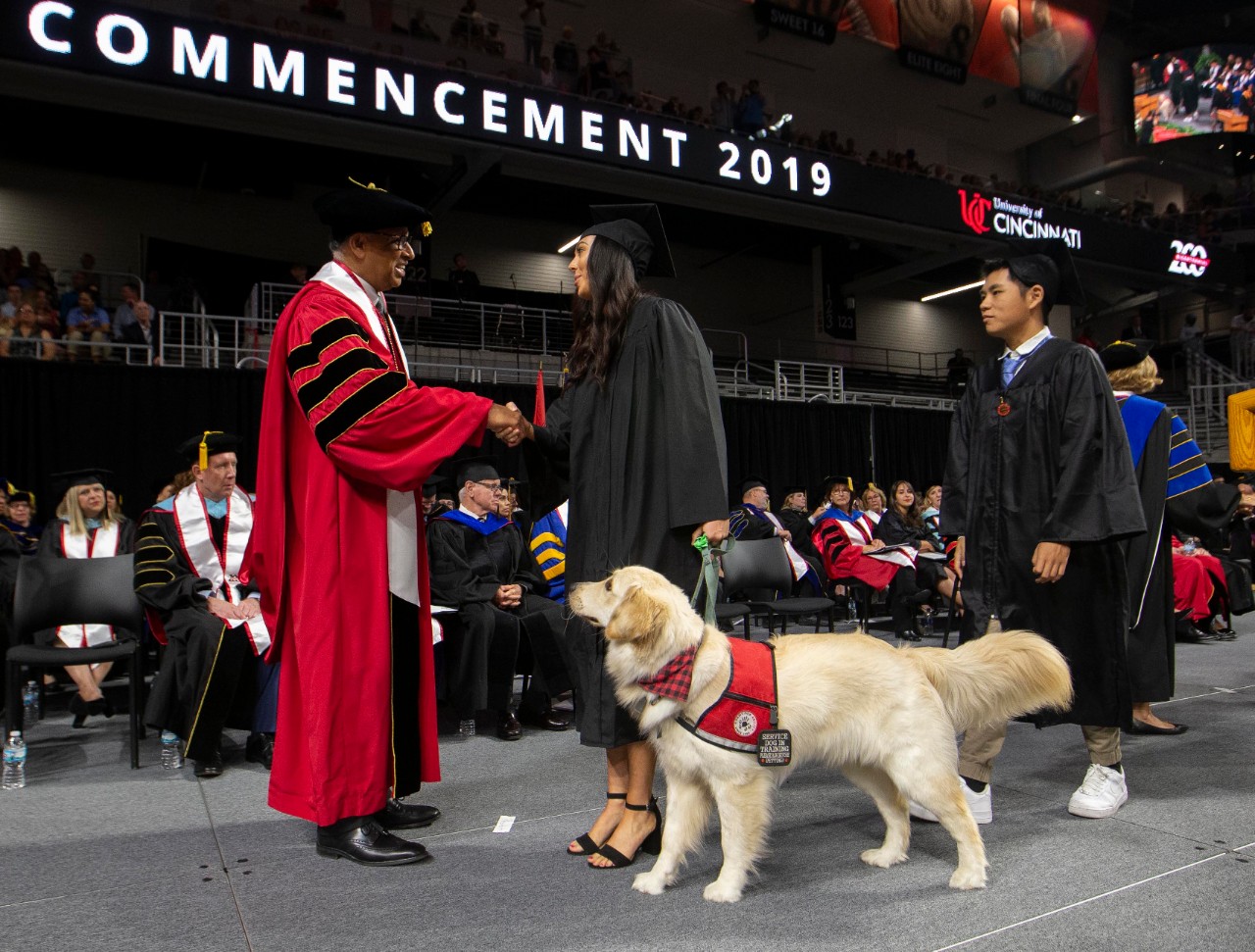 University of Cincinnati president Dr. Neville G. Pinto, faculty, staff, students and families enjoyed the 9am Summer Commencement Ceremony at Fifth Third Area Saturday August 10, 2019. Summer Commencement ceremony includes Doctoral, Master's, Bachelor's, and Associate's degrees for students. University of Cincinnati president Dr. Neville G. Pinto shook the hand of student who walk across stage with their service dog. UC/Joseph Fuqua II