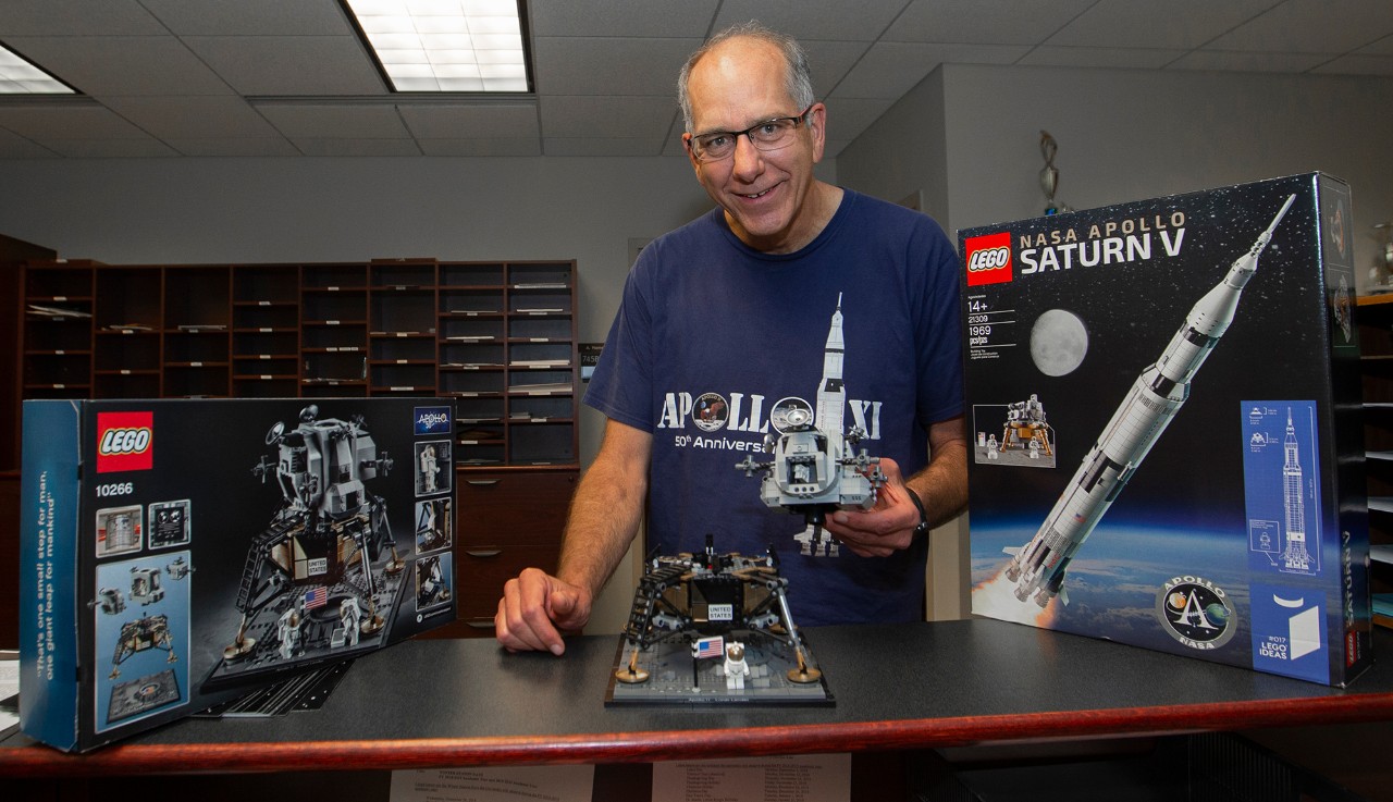 Mark Turner, UC aerospace engineering professor spoke about UC's long connection to the space industry shown here with Lego Apollo Set at Baldwin Hall. UC/Joseph Fuqua II