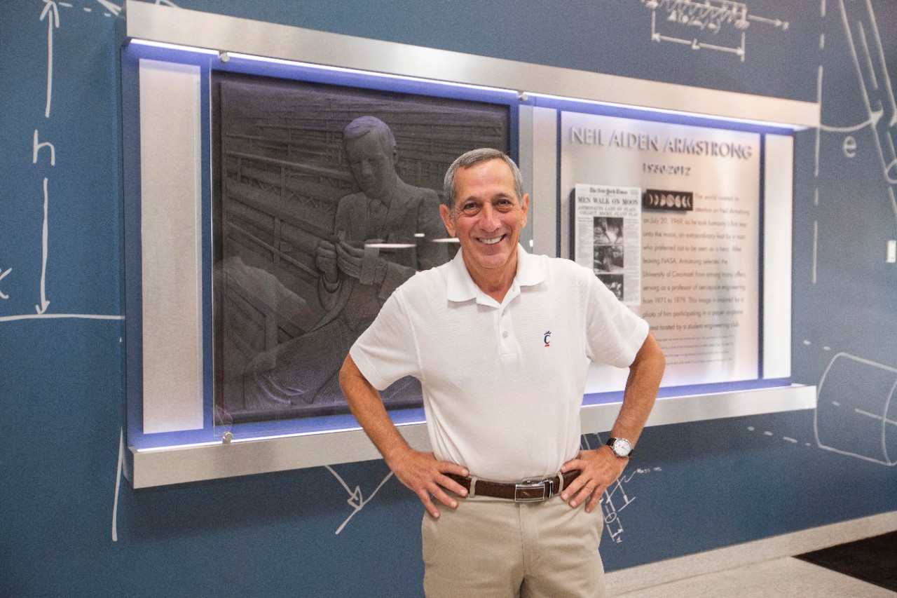 Ralph Spitzen, UC graduate and former student of Neil Armstrong shown here with Armstrong’s relief at Rhodes hall with Armstrong. The Relief was inspired by a photo of Neil Armstrong by Ralph Spitzen. UC/Joseph Fuqua II