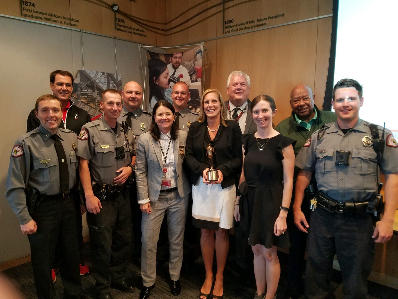 Members of Public Safety stand with the Telly Award.