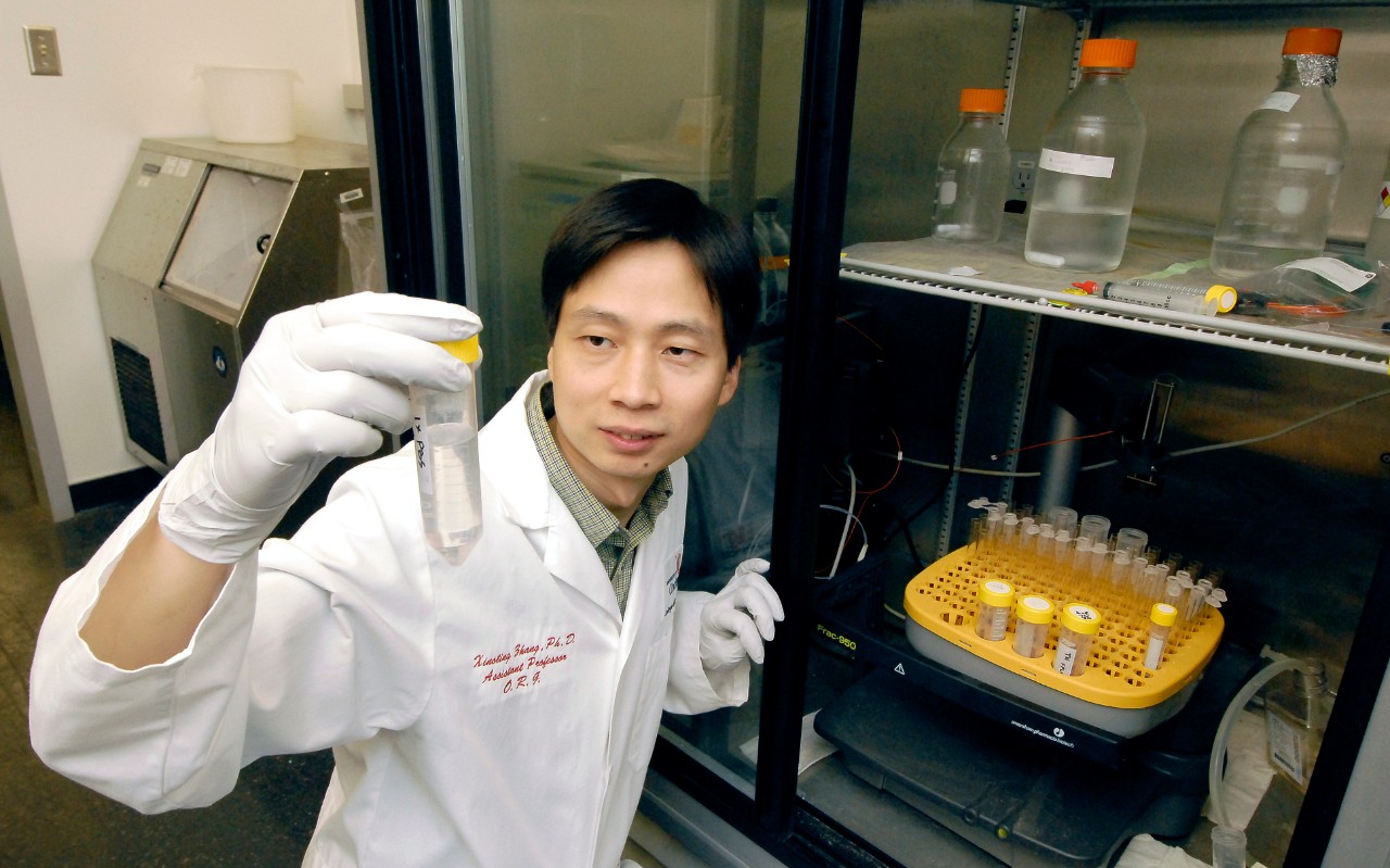 Xiaoting Zhang holding a test tube
