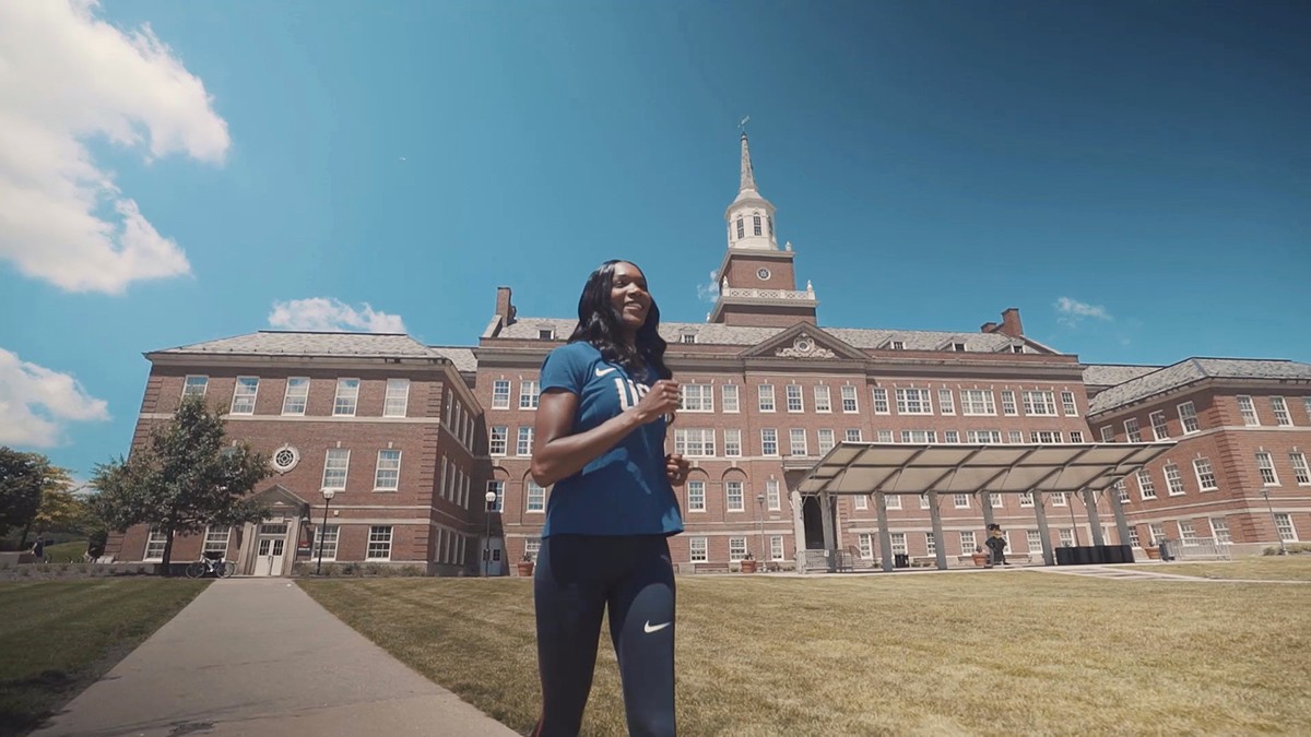 Olympic athlete and UC alumna, Mary Wineberg, jogs outside of McMicken Hall.