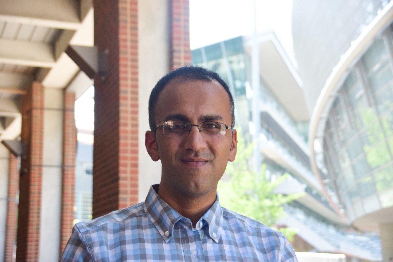 Casual portrait photo of alumnus Sid Thatham on the UC campus. 