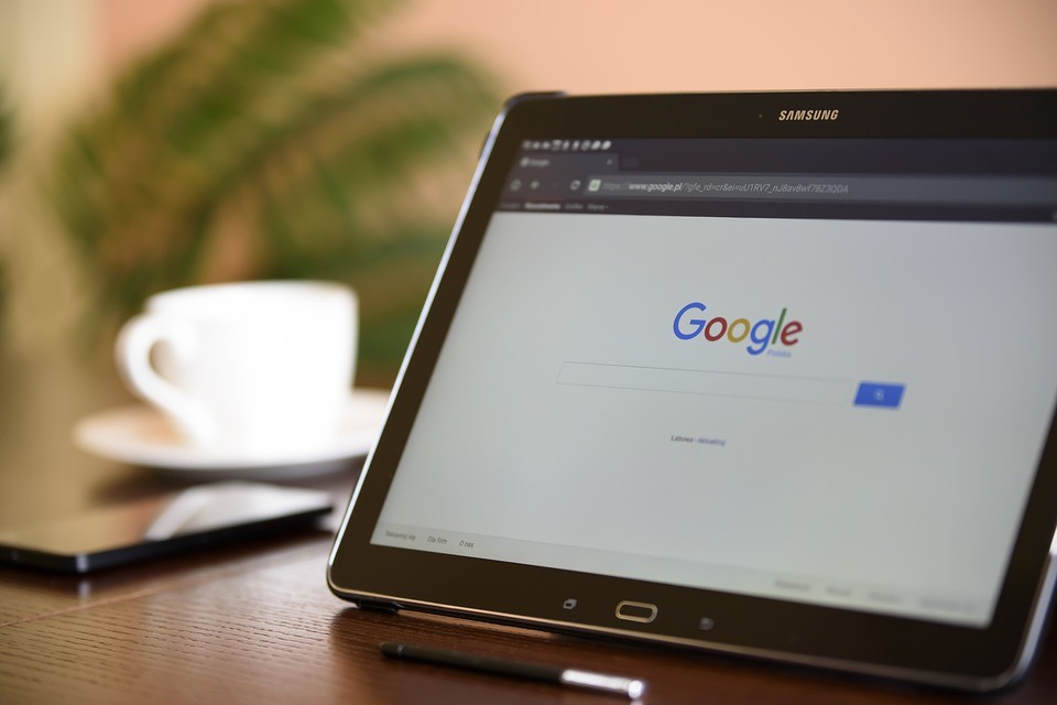 A tablet on a table showing a Google search