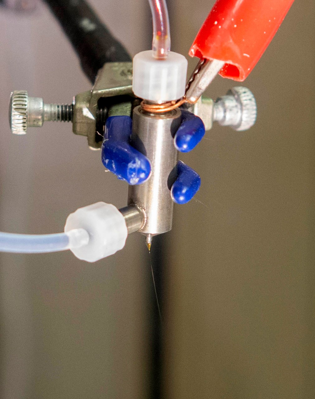 Left to right Daewoo Han, PhD student, UC professor Andrew Steckl, PhD and Serdar Tort, PhD talk in professor Andrew Steckl’s lab at Rhodes Hall. UC/ Joseph Fuqua II