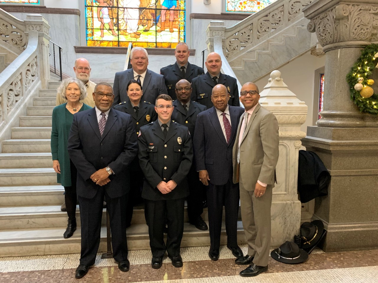 Members of UC Public Safety and the Community Compliance Council stand with Cincinnati Vice Mayor Christopher Smitherman.