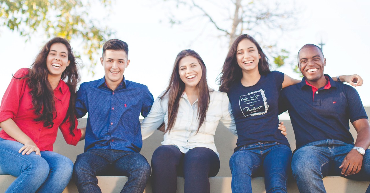 Smiling students with Human Faces of Climate Change text