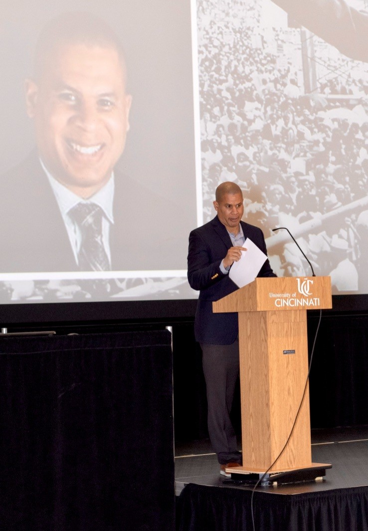 Xavier's Adam Clark speaks from podium in Tangeman University Center at UC.