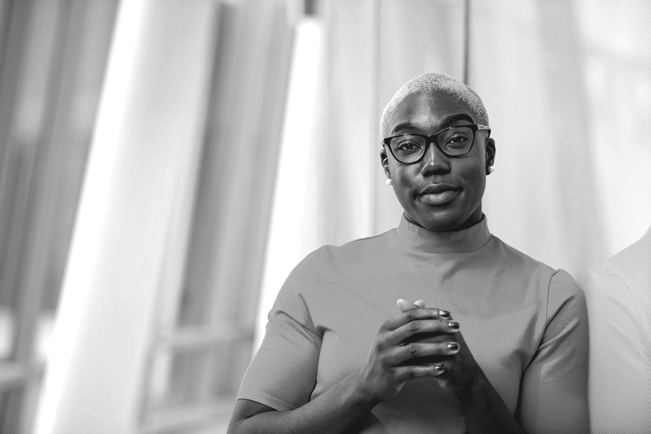 UC student poses outside a campus building