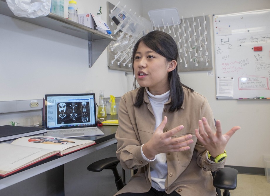 UC biology student Jenny Yi-Ting Sung gestures in a biology lab.