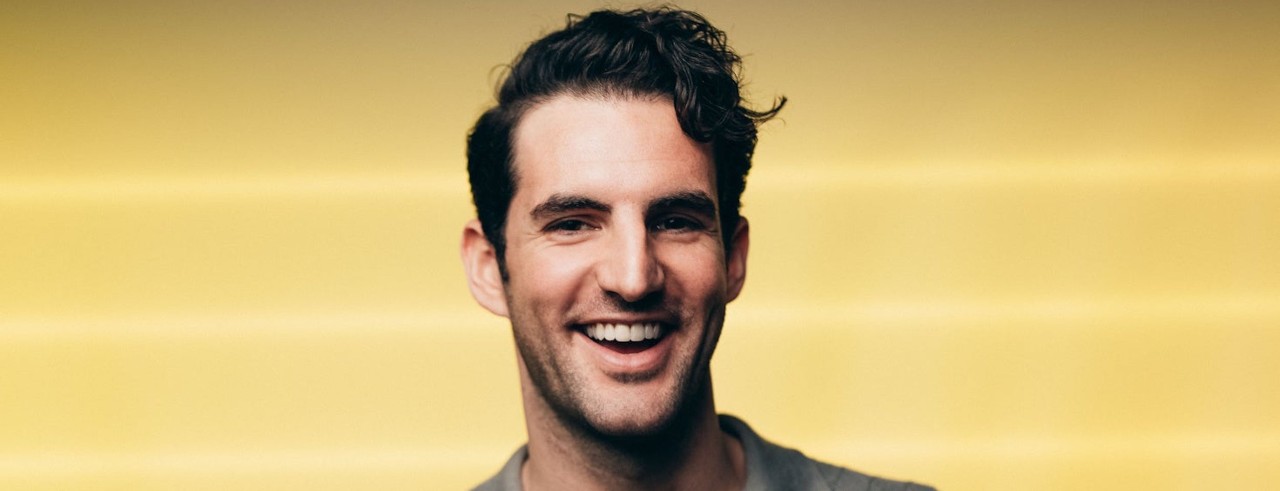 John Riddle smiles