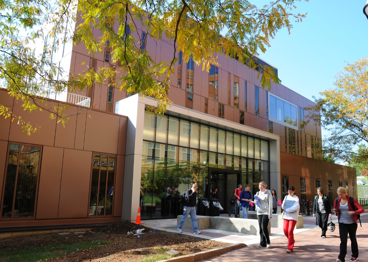Students walk outside the UC College of Nursing