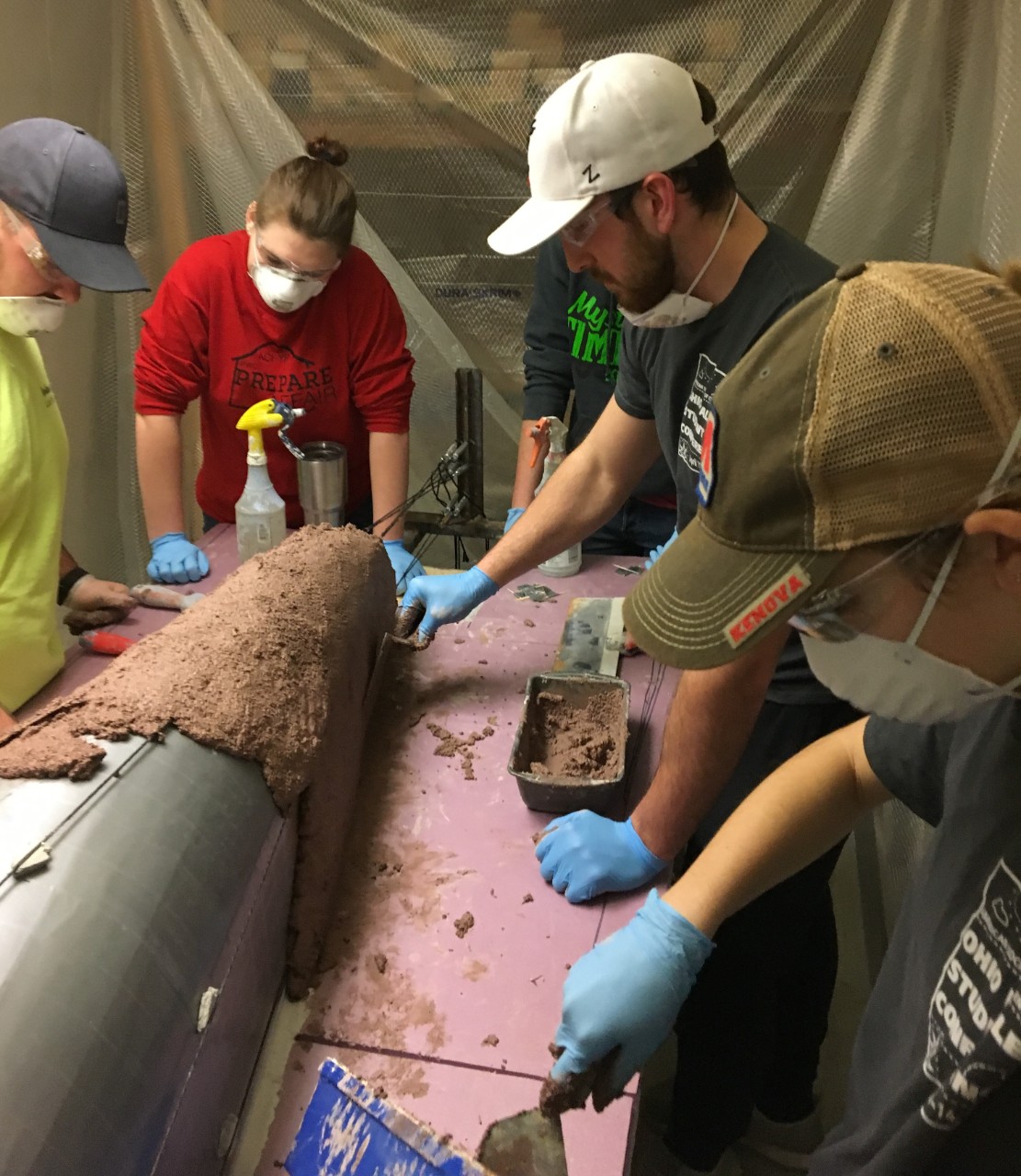 UC civil engineering students construct their concrete canoe for competition.