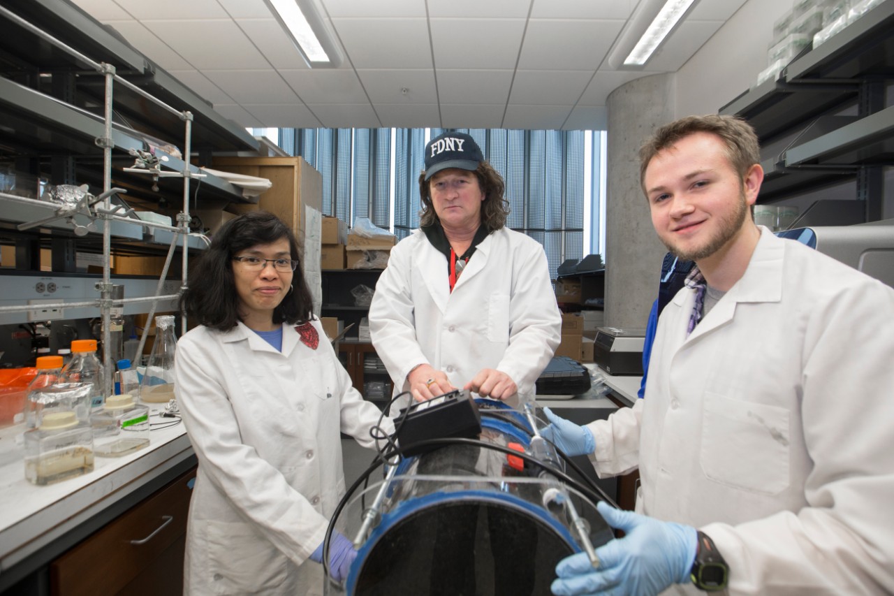 Daniel J. Hassett, middle Emerging Entrepreneurial Achievement Award winner shown here with 4th year PhD student Cameron McDaniel and Warunya Panmanee research associate in Hassett Lab at Care/Crawley. UC/ Joseph Fuqua II