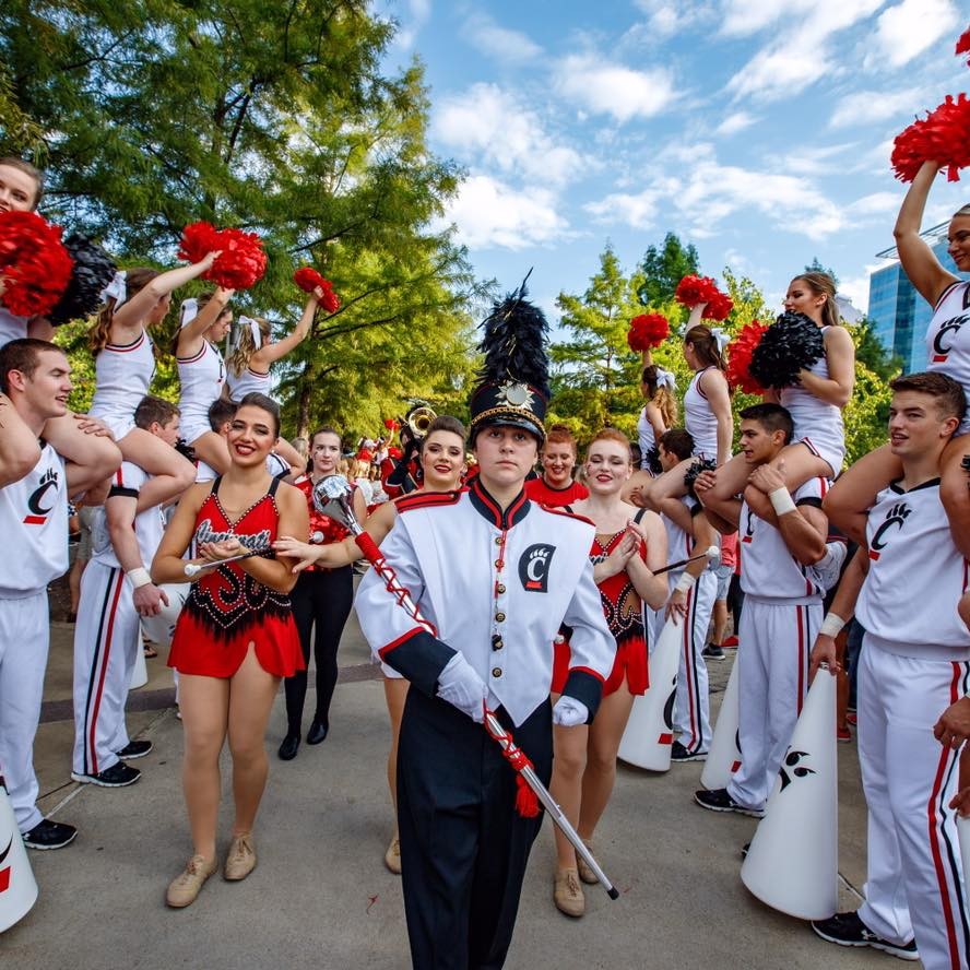 Anna Lanzillotta leads the UC Marching Band in a parade
