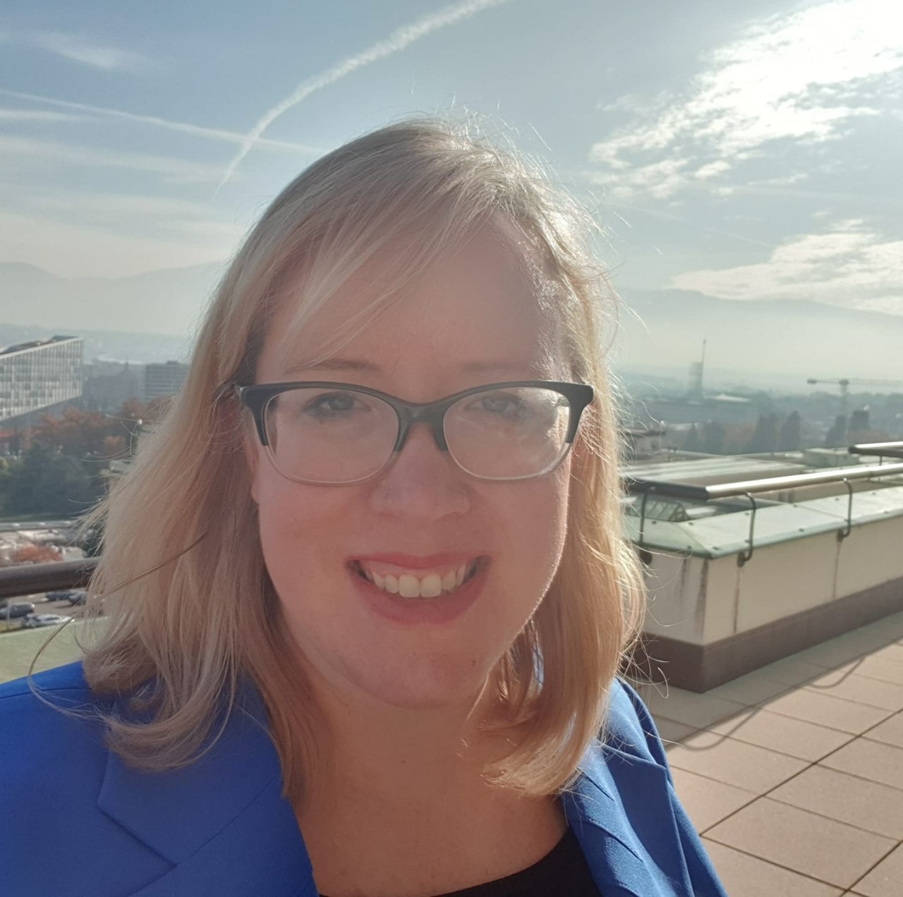 Woman in courtyard smiling