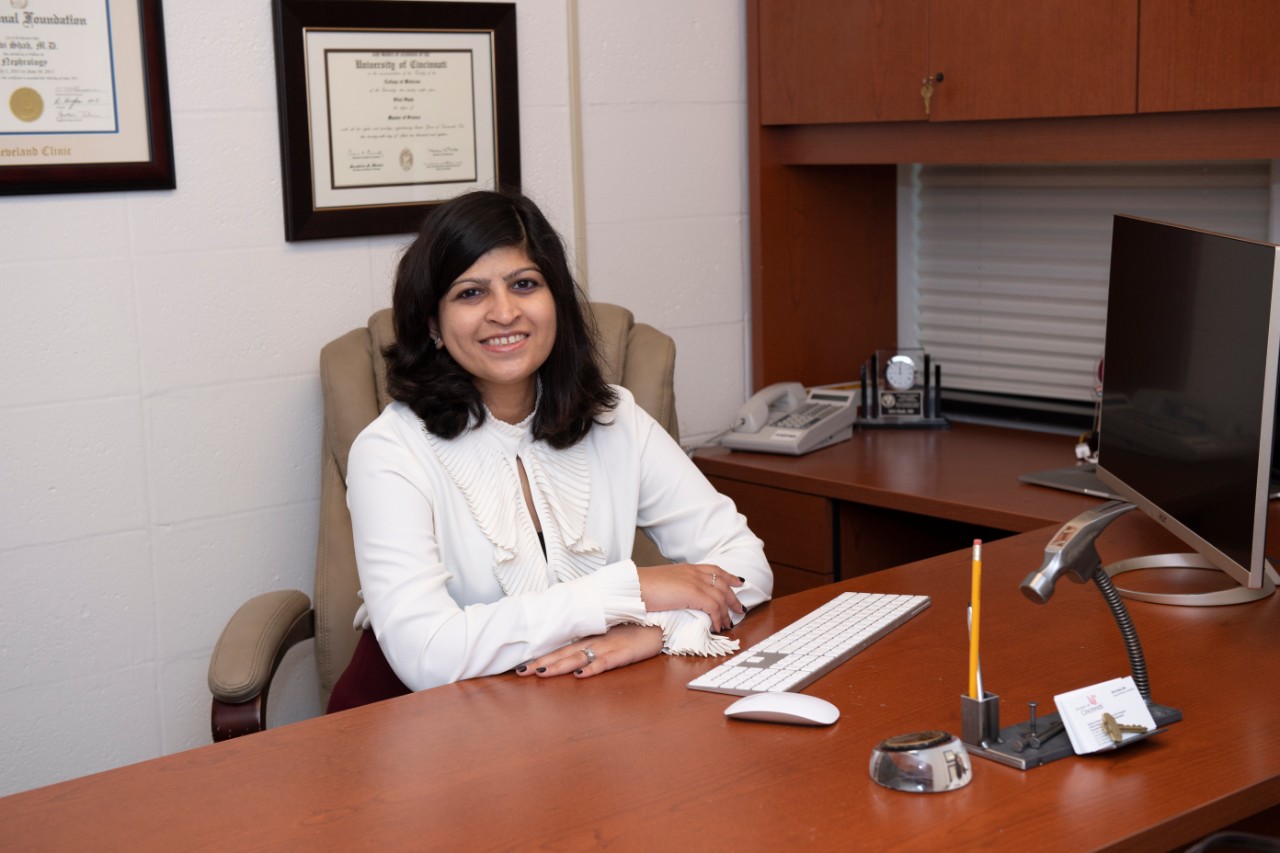 Silvi Shah, MD, on bridge and ini office.