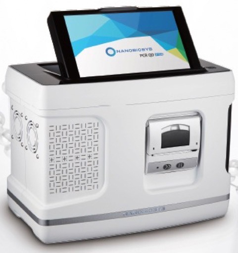 The portable coronavirus testing device is the size of a toaster with a tablet screen