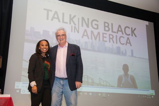 Lauren Prather and Walt Wolfram stand in front of a screen that reads "Talking Black in America" 