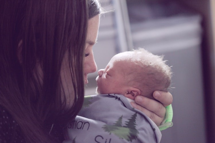 woman hold newborn