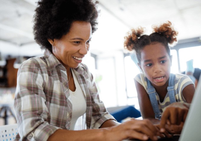 A mom and daughter explore online together