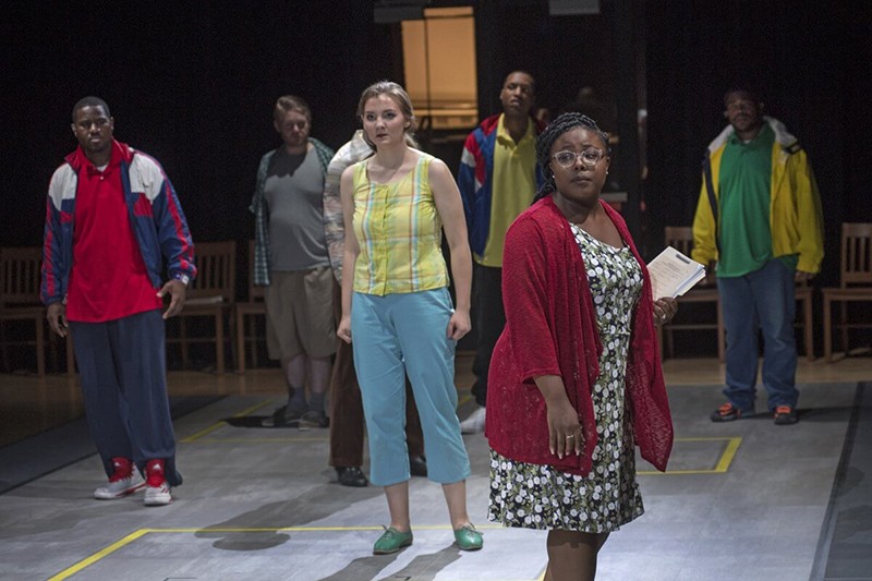 Actors on stage sing during the "Blind Injustice" opera.