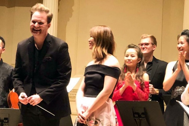 Musicians bow after a performance
