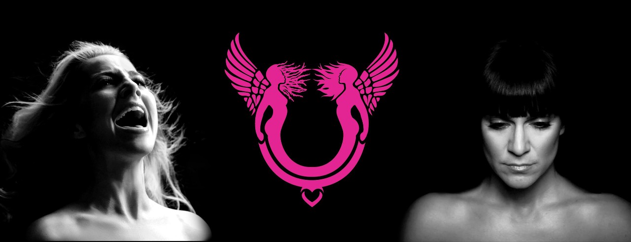 Female performers singing against a black background