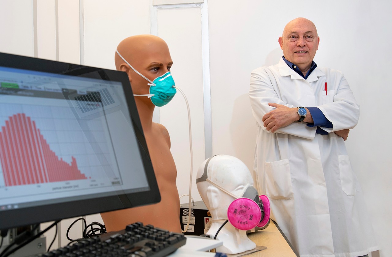 Sergey A. Grinshpun, PhD, professor of Environment Health, with a N95 respirator face mask  in his lab at the University of Cincinnati Center for Health Related Aerolsol Studies.  