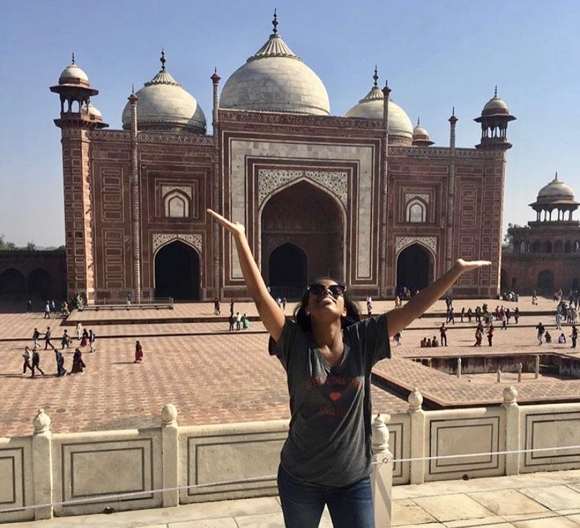 UC's Angel Brown stands in front of a large building in Agra, India.