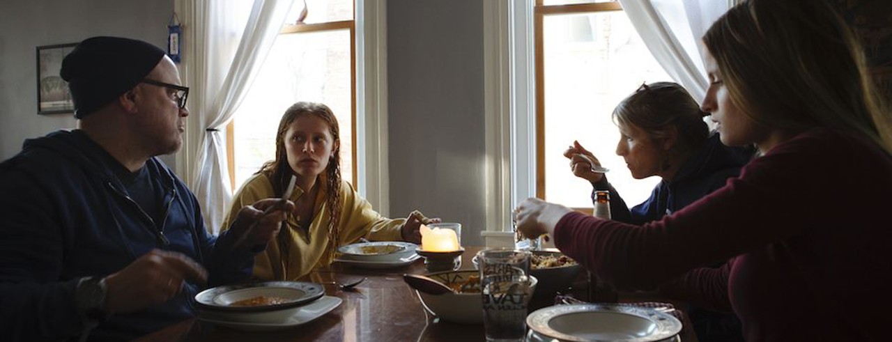 A photo of CCM faculty member Ric Hordinski and his family sharing a meal at the dining table in their home. Photo/Madeleine Hordinski