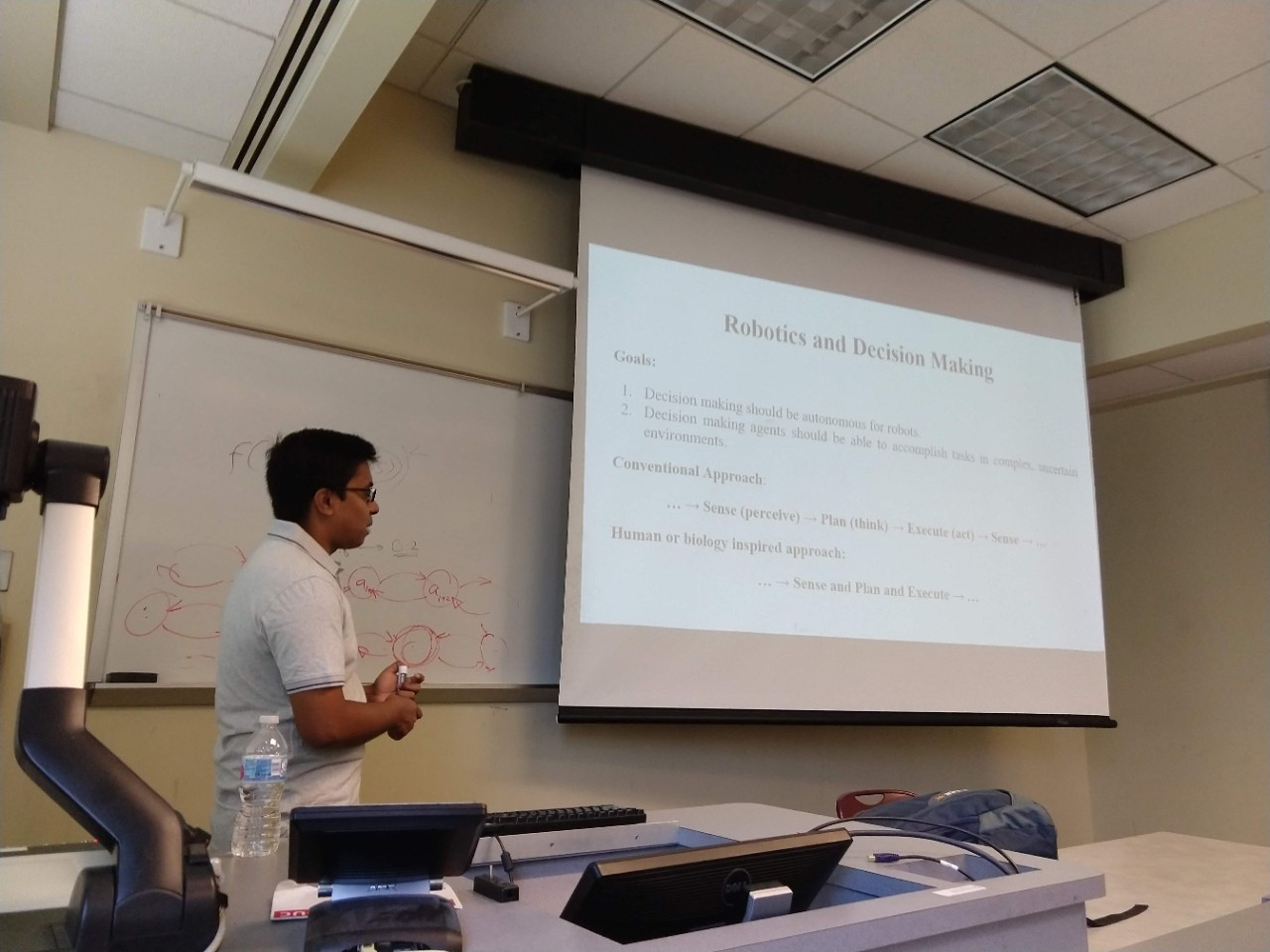 Aditya Deshpande lectures students on robotics and decision making.