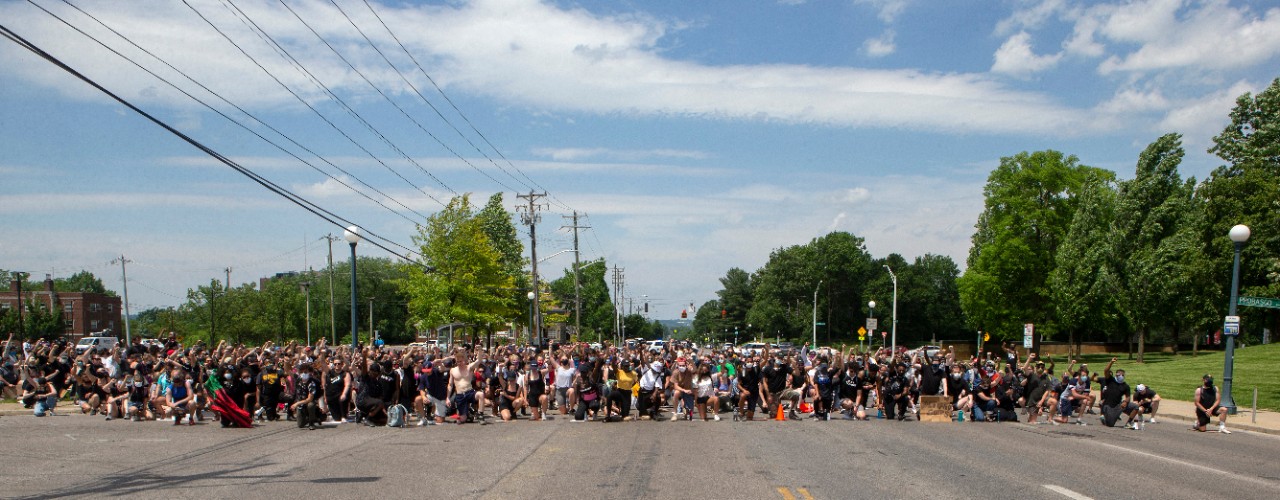 Protesters kneeled for 9 minutes on Clifton Avenue right before MLK. About 800 protesters marched for George Floyd, Breonna Taylor and Ahmaud Arbery Wednesday June 3, 2020 as part of a Black Lives Matter Cincinnati action. UC/ Joseph Fuqua II