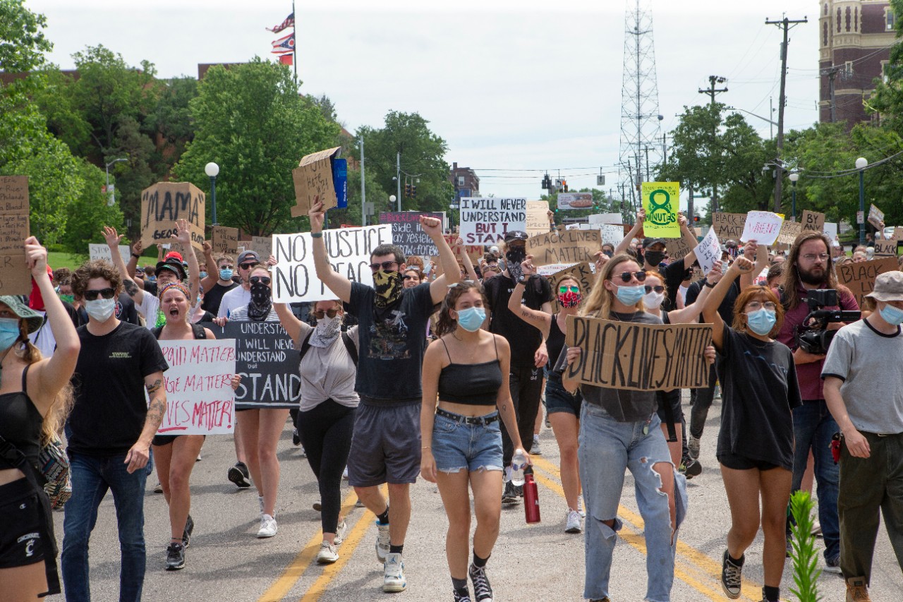 University of Cincinnati police Captain Rodney Carter, left and  University of Cincinnati police Assistant Chief Dudley Smith marched with protesters. About 800 protesters marched for George Floyd, Breonna Taylor and Ahmaud Arbery Wednesday June 3, 2020 as part of a Black Lives Matter Cincinnati action. UC/ Joseph Fuqua II