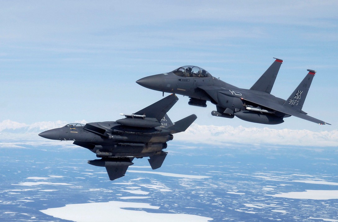 A fighter jet pursues another.