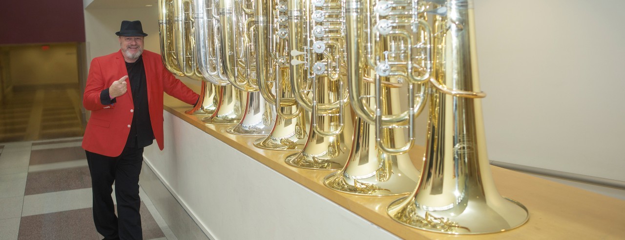 Tim Northcut poses with tubas