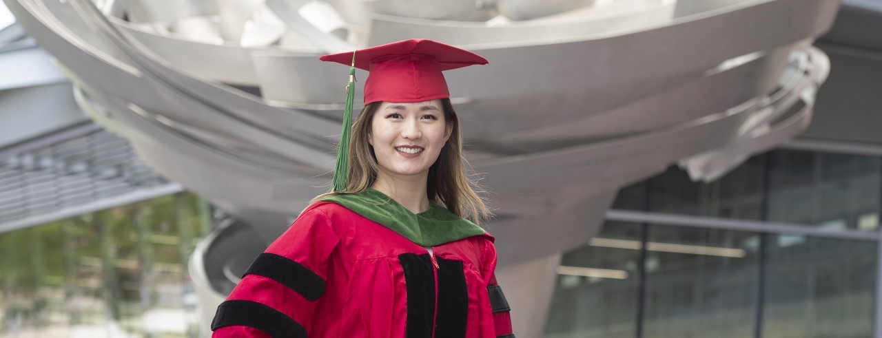 Vicky Yu poses in her cap and gown.