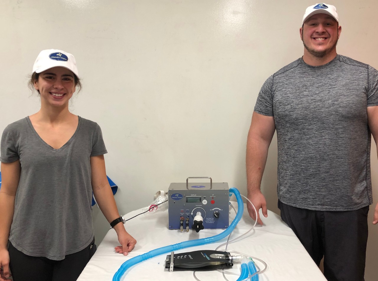 Biomedical engineering students, Johnathan Wisecarver and Jacquelyn Chapman, pose with the Venti-Now ventilator