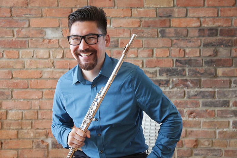 A headshot of Chaz Salazar with his flute