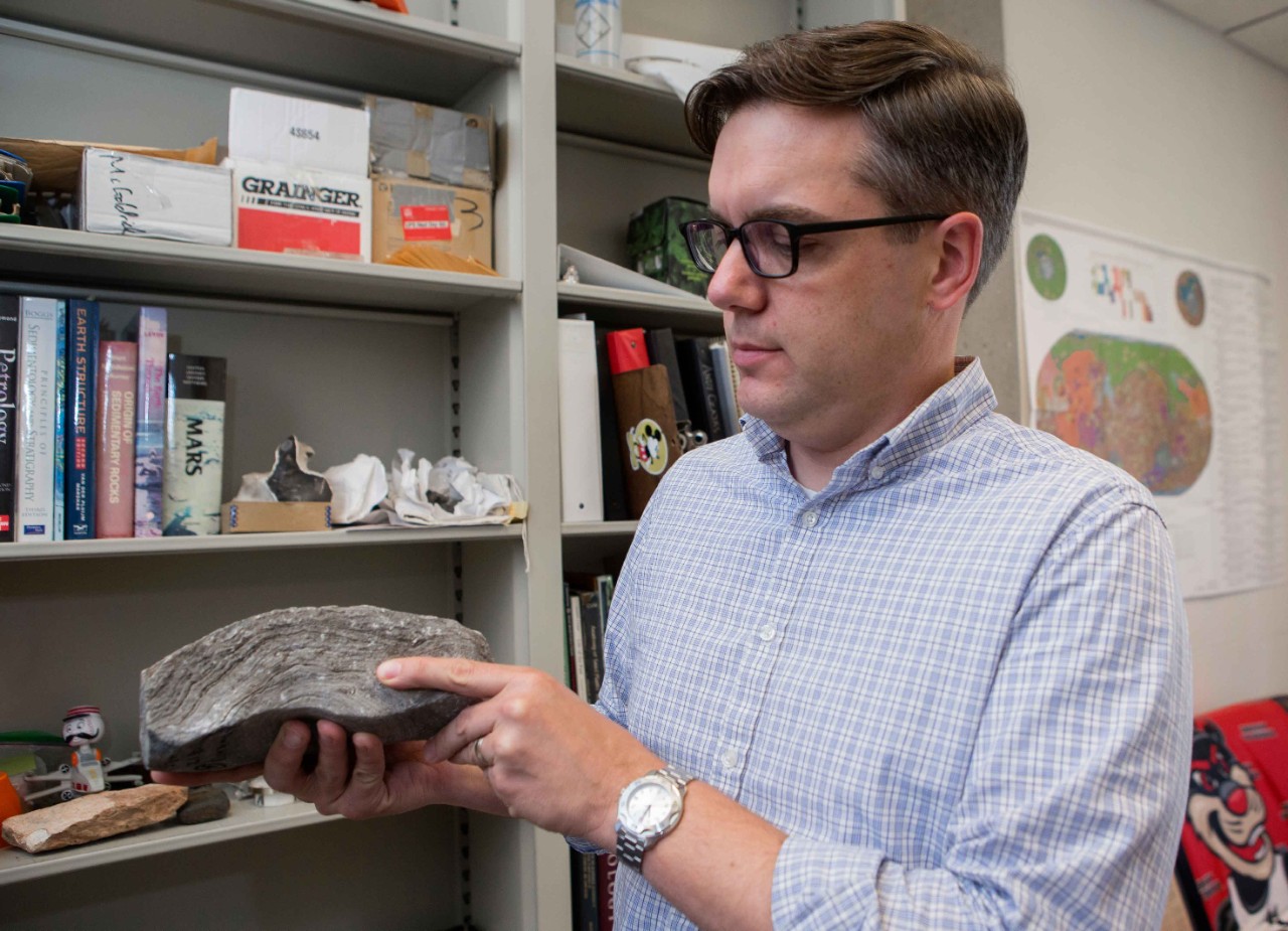 Geology Assistant Professor Andrew Czaja held some of his rocks in his office in the GEO-PHYS building. UC/ Joseph Fuqua II