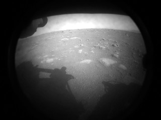 A black and white photo of the surface of Mars.